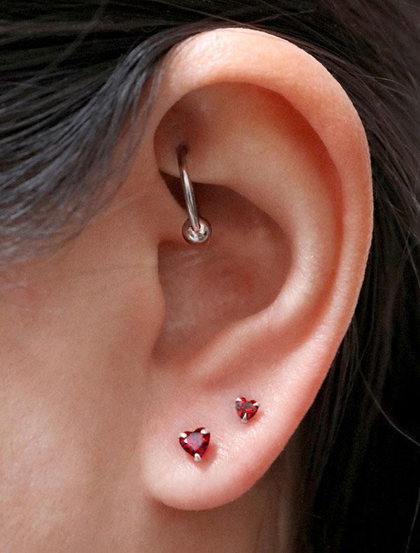 earrings tiny red heart studs modelled
